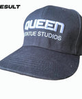 Black cap with 'Queen Statue Studios' logo, Hat Shaper Brim Bender Set for Perfect Curve on Fitted Hats Two Size Adjustable Tools shown.
