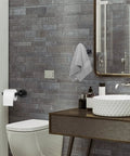 Industrial Black Toilet Paper Holder And Towel Ring Set For Bathroom in use, wall-mounted in modern bathroom setting.