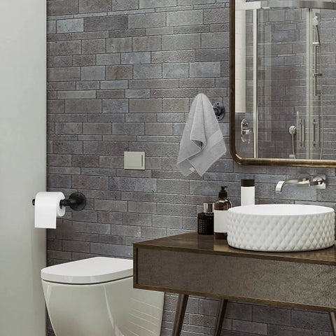 Industrial Black Toilet Paper Holder And Towel Ring Set For Bathroom in use, wall-mounted in modern bathroom setting.
