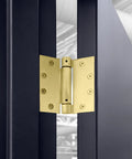 Heavy Duty 4.5 Inch Spring Hinge For Interior And Exterior Doors showing satin brass finish installed on blue door.