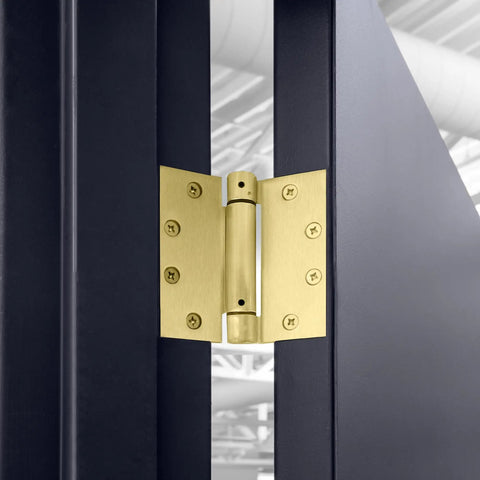 Heavy Duty 4.5 Inch Spring Hinge For Interior And Exterior Doors showing satin brass finish installed on blue door.