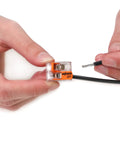 Hand holding Bulk Slick Heavy Duty Twistless Lever Wire Connectors For Solid Or Stranded Conductors Two Conductor Quick Swap