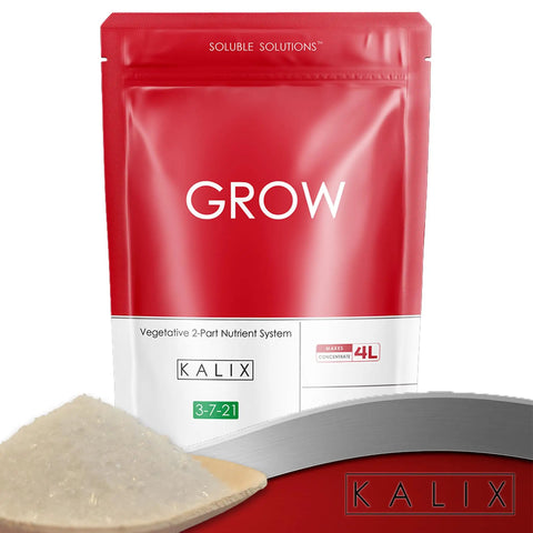 Red package of Grow Fertilizer for Hydroponics and Soil Water Soluble Veg Nutrients for Tomatoes Leafy Greens in a greenhouse