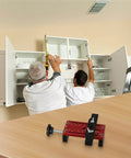 Two men installing cabinets using Heavy Duty Cabinet Door Positioner Clamp, Adjustable Aluminum Alloy Vertical Installation Tool