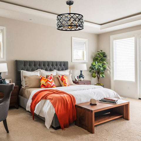 Bedroom with elegant vintage crystal chandelier in matte black with gold accents above bed, matching product description.
