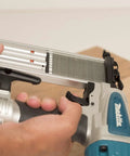 Rock Solid 18 Gauge 2 Inch Brad Nailer Kit held in hand, showing toolless jam clearing feature and depth adjustment.