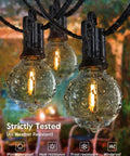 Close-up of wet IP65 G40 LED globe bulb in 2 Pack 25Ft Outdoor Globe String Lights With 12 Plus 1 LED G40 Plastic Shatterproof Bulbs Waterproof