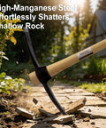 Beefy Heavy Duty Pickaxe With Wood Handle in action breaking a stone pathway, showcasing forged high carbon steel head.