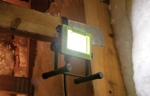 Bright 1080 Lumen LED Weatherproof Tiltable Portable Work Light With Large Adjustable Metal Hook mounted in attic space