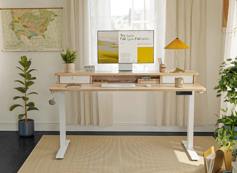 Fezibo 48 By 24 Electric Standing Desk With Double Drawers Maple Finish height adjustable with monitor and decor in home office.