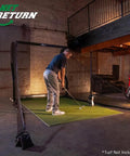 Golfer practicing indoors with Mevo Launch Monitor Bundle With Pro Series Golf Net And Side Barriers For Indoor And Outdoor Practice
