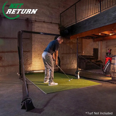 Golfer practicing indoors with Mevo Launch Monitor Bundle With Pro Series Golf Net And Side Barriers For Indoor And Outdoor Practice