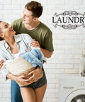 Couple carrying laundry with 'LAUNDRY' vinyl decal, part of Three Pack Large Vinyl Door Decals For Bathroom Laundry And Pantry Wall Decor Peel