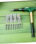 Top Shelf Wall Mounted Gate Hinges 4 Pack Swinging Barn Door Brackets with screws and installation tool on green wood.