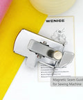 Front view of a silver magnetic seam guide for sewing machine with knob, shown beside yellow fabric and WENICE card.