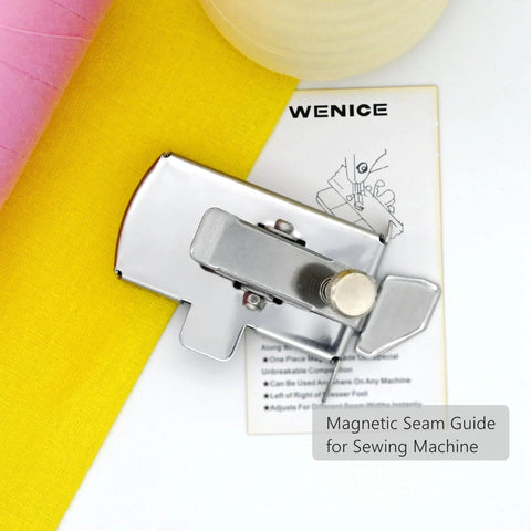 Front view of a silver magnetic seam guide for sewing machine with knob, shown beside yellow fabric and WENICE card.