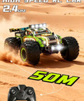 Rugged Dino Theme RC Monster Truck For Kids Ages 4 To 12 racing on sand with remote control in view.