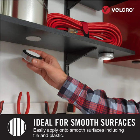 Heavy Duty Industrial Hook And Loop Fasteners With Rock Solid Adhesive Backing Water Resistant Sticky Pads For Indoor And Outdoor Use Tough Circular Disc Strips Hold Up To Ten Pounds, applying to a smooth surface.