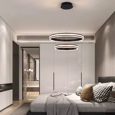 Modern Crystal Chandelier With Dimmable LED Pendant Light In Black, Acrylic Double Ring Design, in a stylish bedroom setting