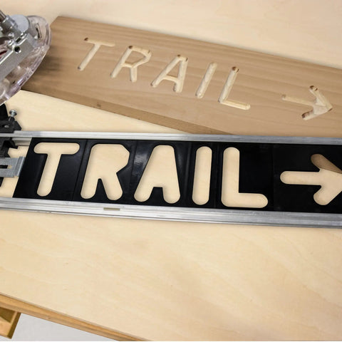 Badass Custom Wood Sign Router Template Kit Featuring Dope Arrow And Symbol Stencils for creating 'TRAIL' sign with templates.