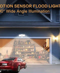 Outdoor Motion Sensor Light 20W LED Flood Fixture With 2 Adjustable Heads illuminating a garage at night with 180 degree sensing