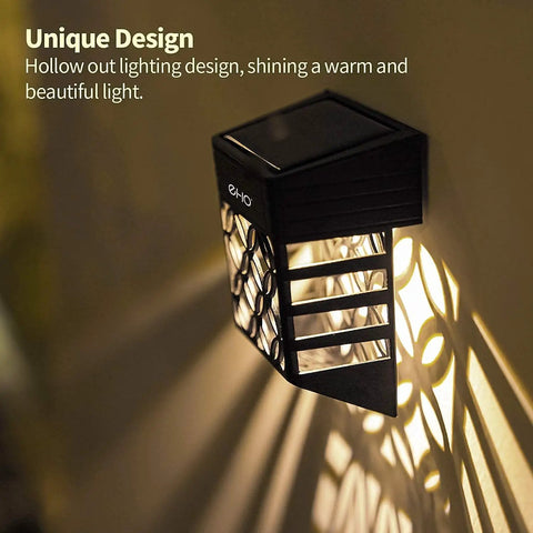 Halloween Solar Deck Lights Outdoor Waterproof LED Garden Decor 4 Pack mounted on wall with light pattern