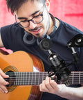Guitarist using Pro Condenser Mic Shock Mount For 43mm To 47mm Mics, Anti Vibration Suspension Clip, studio recording setup