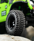 Close-up of Maverix MT RC Tires For 1 30 Scale Axial SCX30 showing dense tread and S5 compound on rocky terrain.