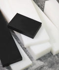 Assorted white and black HDPE blocks in various sizes, showcasing the Two Pack HDPE Tapping Block For Machining And DIY Projects.