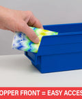 Hand placing item in blue Heavy Duty Plastic Shelf Bin with curved front for easy access, 12 by 4 by 4 inches, 24 pack