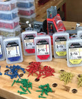 Assorted pocket hole screws on a workbench with containers, not showing Two And A Half Inch Coarse Thread Pocket Hole Screws 500 Pack