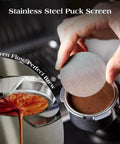 Stainless steel puck screen from 7 Piece Espresso Tools Kit For 54mm Breville Portafilters, held above portafilter