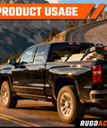 Black truck using Heavy Duty Ratchet Tie Down Straps 1 Inch By 10 Feet 900 Lbs Break Strength 8 Pack for secure hauling.
