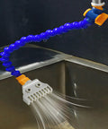 Two Pack G1/4 BSPT Male ABS Flat Nozzle Set for air blow off, attached to a flexible hose, spraying water, in a grey industrial setting.
