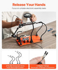 Person using Magnetic Helping Hands Soldering Station With 3X LED Magnifying Lamp, 4 PCB Holders on a table.