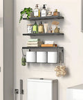 Heavy Duty Floating Bathroom Shelves Wall Mounted Set Of Three With Slick Black Finish For Over Toilet Storage and moisture resistant solid wood shelving that handles daily use without the drama, displaying toiletries.