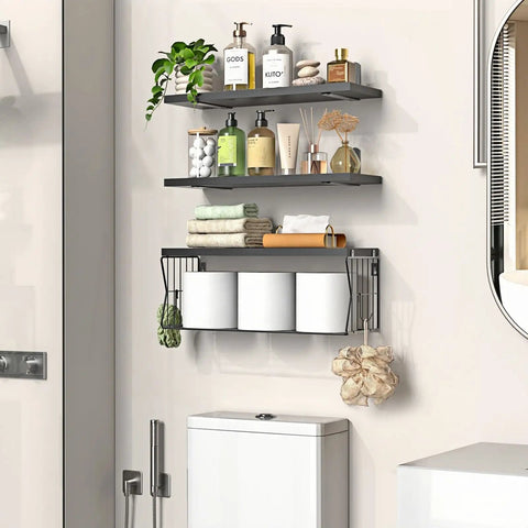 Heavy Duty Floating Bathroom Shelves Wall Mounted Set Of Three With Slick Black Finish For Over Toilet Storage and moisture resistant solid wood shelving that handles daily use without the drama, displaying toiletries.
