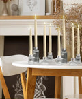 Flameless Taper Candles Set Of 4, 11 Inch Ivory Real Wax with 3D Wick Flame on dining table, perfect for cozy home decor