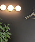 Modern 3 Light Globe Vanity Light Fixture Brushed Nickel Wall Mount Sconce For Bathroom Mirror Cabinets Hallway And Stairs With Opal Glass Diffused Globe Shades mounted on wall