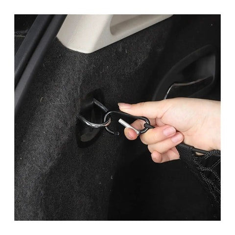 Three Compartment Hammock Cargo Net For Tesla Cybertruck 2024 Plus Trucks being attached with hooks for secure storage use.