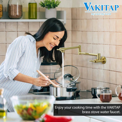 Woman using gold pot filler wall mount faucet with double joint swing arm in kitchen, high flow brass construction.