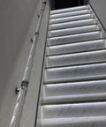 Sleek Transparent Acrylic Handrail With Heavy Duty Silver Wall Mount Brackets For Indoors Outdoors Stair And Deck Safety Featuring Bubble Design Supporting Four Hundred Forty Pounds Built Like A Tank For Daily Grind on illuminated stairs.