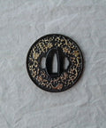Koshirae Style Samurai Sword With Alloy Tsuba 100 Black And Gold Morning Glory Pattern detail shot of ornate tsuba