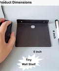 Straight Fire Black Metal Floating Wall Shelf For Echo Dot Alexa Smart Speakers Cameras Compact Rack dimensions shown with a mouse.