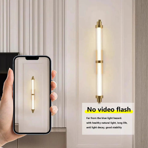 JGSYD Led Modern Wall Lamp Indoor with Remote Control Wall Light 2700K-6500K Dimmable Wall Sconce Long Strip Decorative Wall Lighting Stainless Steel for Bedroom Hallway Living Room,Black-70Cm shown on a wall with a smartphone.