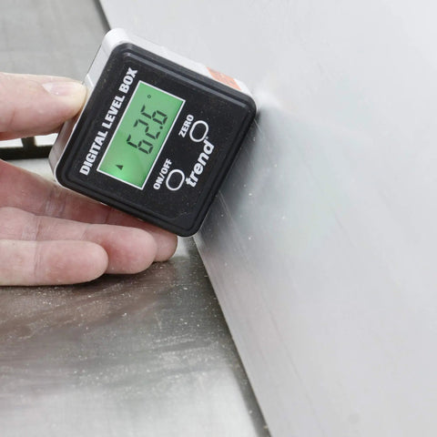 Digital Level Box And Angle Finder With Slick Magnetic Base And Backlit LCD Screen For Table Saw Miter Saw Blade Setup And Zero Sweat Bevel Cuts That Get Your Blades Dead On For Any Weekend Warrior Shop Build Black; displaying an angle reading of 62.6 degrees on a metallic surface.