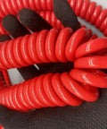 Close-up of Straight Up Heavy Duty Stretch Coiled Extension Cord With Hella Tough Polyurethane Jacket coiled in hands.