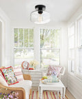 Industrial Semi Flush Mount Ceiling Light With Clear Glass Pendant Shade in a cozy sunlit room with farmhouse decor.