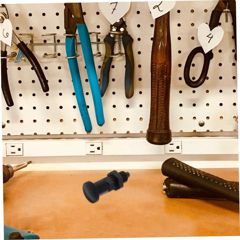 Heavy Duty Carbon Steel Reset Type Indexing Plunger on workbench with tools, used for industrial machinery and toolboxes.