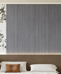 PVC Slat Wall Panel Peel And Stick Self Adhesive Wallpaper 3D Tiles with realistic faux wood grain in blue used as bedroom accent wall.
